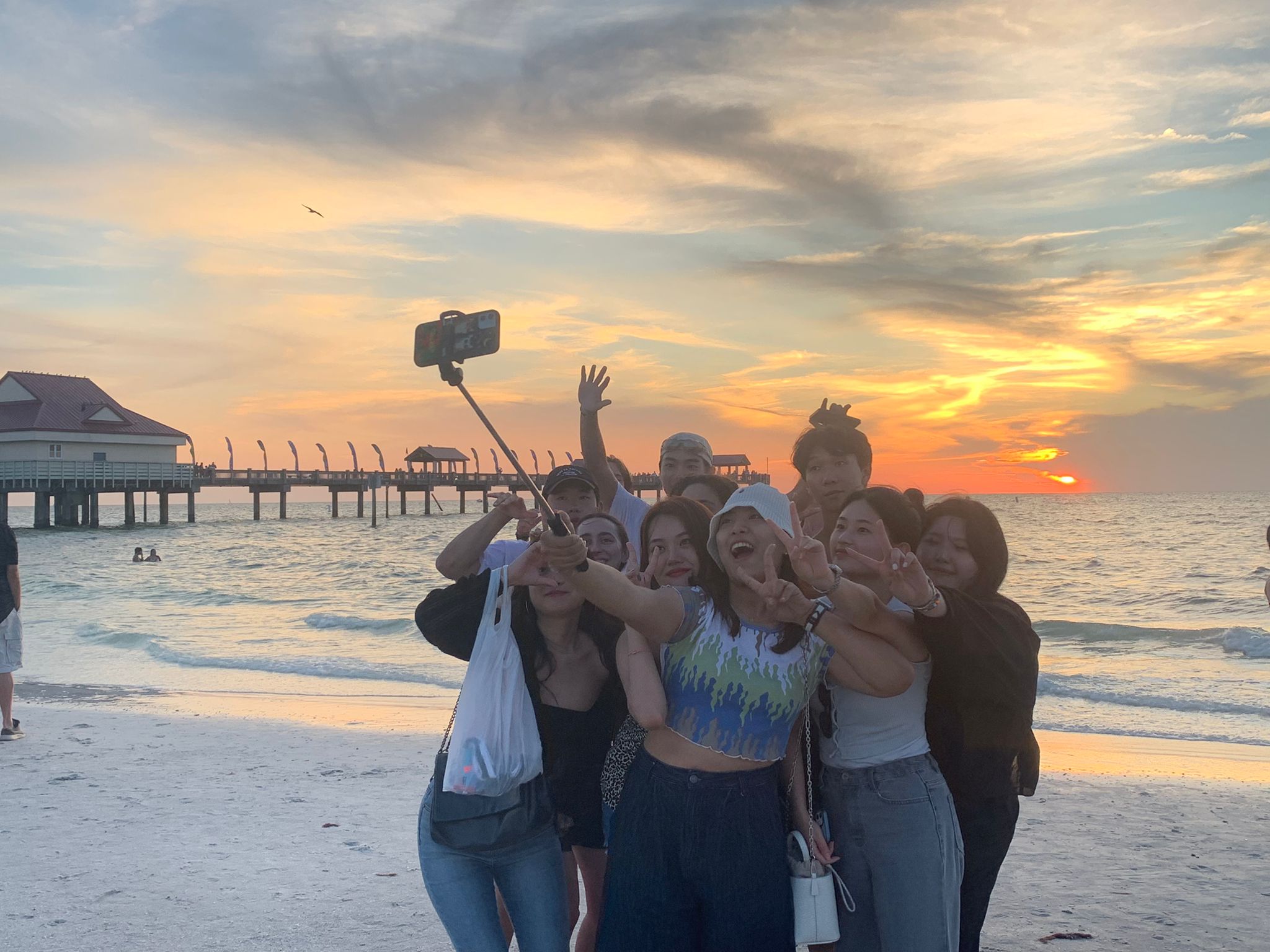 ELI students take a photo at sunset at Clearwater Beach.