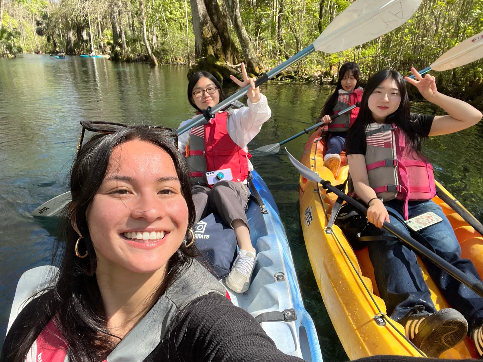 Happy students paddling canoes at Silver Springs.