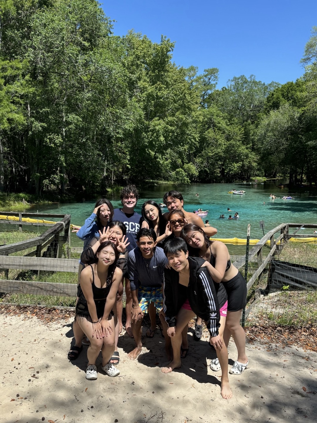 Students posing in front of beautiful Blue Spring